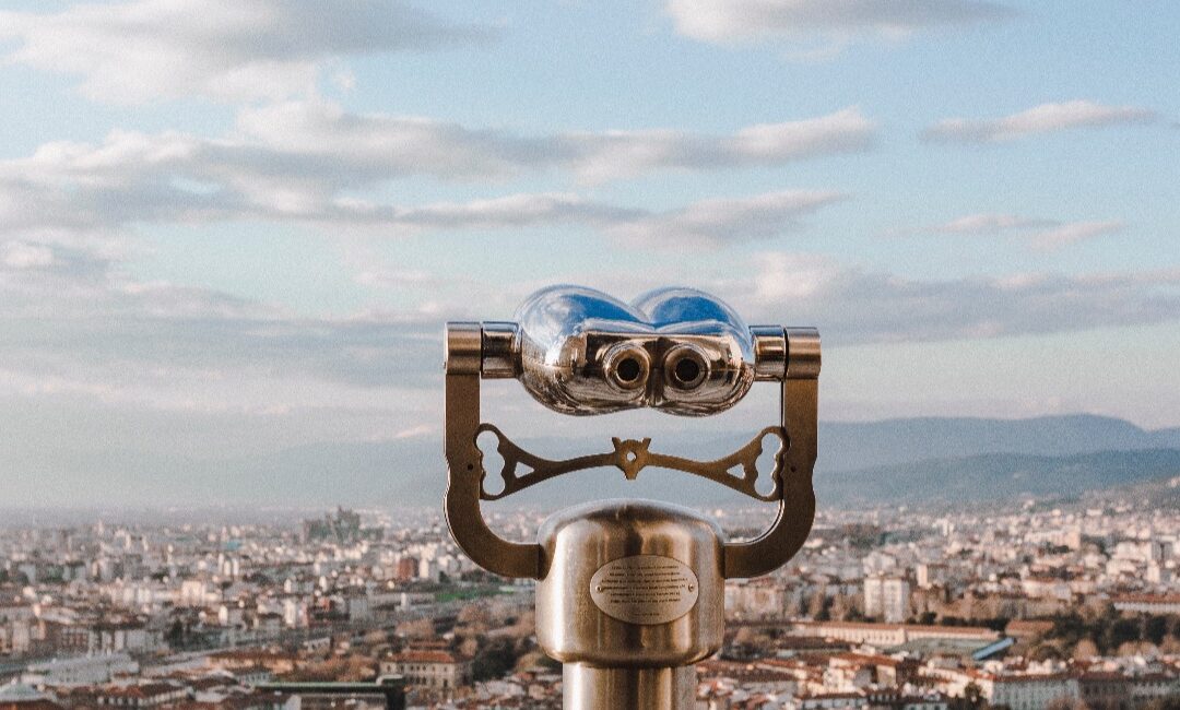 tourist binoculars looking out over a city