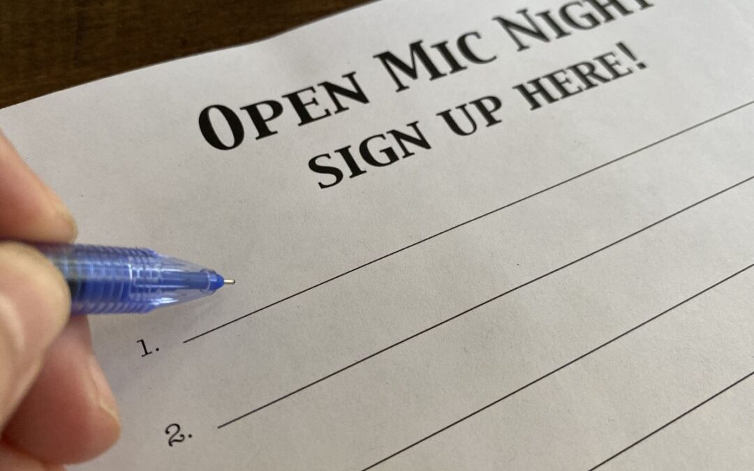 close-up of a sign-up list for open mic night