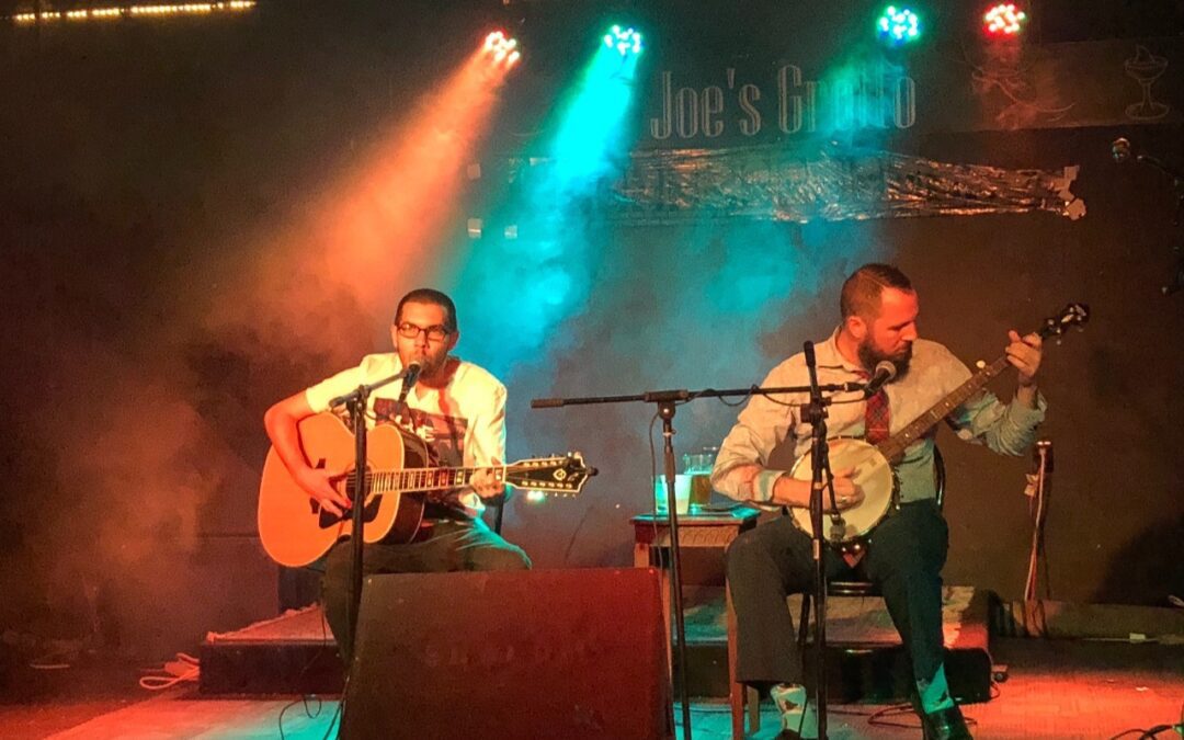 two performers on stage at Joe's Grotto