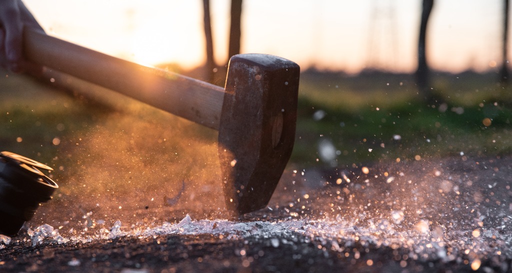 sledge hammer hits an anvil